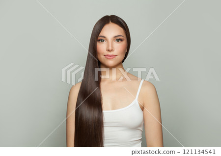 Glorious model woman with sleek long shiny brown hair. Cosmetology, hair and skin care Glorious model woman with sleek long shiny brown hair. Cosmetology, hair and skin care 121134541