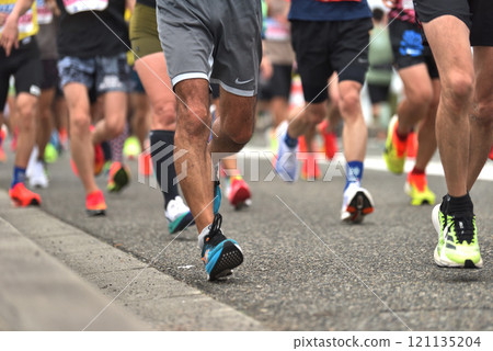 Marathon: A marathon runner running up a hill Marathon: A marathon runner running up a hill 121135204