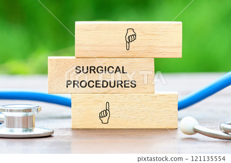 Surgical procedures blocks with medical instruments set on wooden surface outdoors Surgical procedures blocks with medical instruments set on wooden surface outdoors 121135554