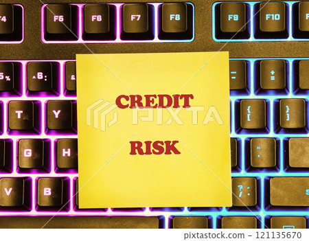 Money interest rate increase concept, percentage commission credit. CREDIT RISK Concept Label on a yellow sticker lying on the keyboard 121135670