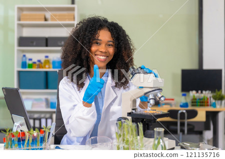 Portrait of a successful Microbiologist with inspiration in Modern Food Science Laboratory. 121135716