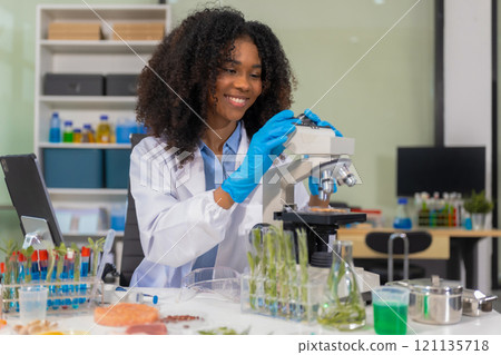 Portrait of a successful Microbiologist with inspiration in Modern Food Science Laboratory. 121135718