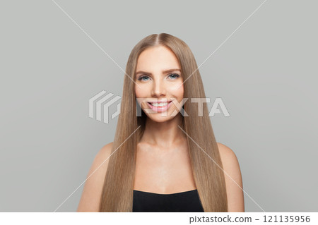 Nice female model brunette with long hair and natural make-up posing isolated on white background 121135956