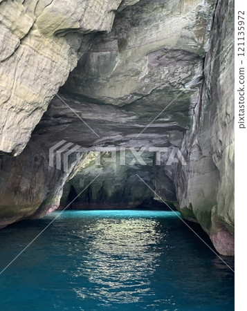 Take a sightseeing boat tour of the mysterious Blue Cave 121135972