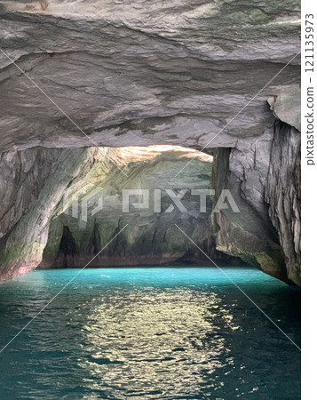 Take a sightseeing boat tour of the mysterious Blue Cave 121135973