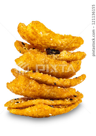 Closeup view stack of crispy homemade multigrain rice cracker. 121136155