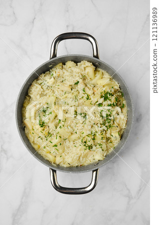 Homemade rice and pear dish garnished with melted blue cheese and herbs, ready for dinner Homemade rice and pear dish garnished with melted blue cheese and herbs, ready for dinner 121136989