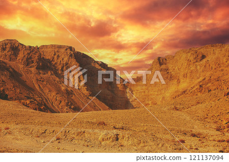 Mountain desert. Sandstone mountains against the blue sky Mountain desert. Sandstone mountains against the blue sky 121137094