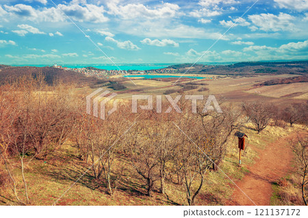 Aerial view of Balaton lake and valley with orchard in early morning. Tihany peninsula, Hungary 121137172