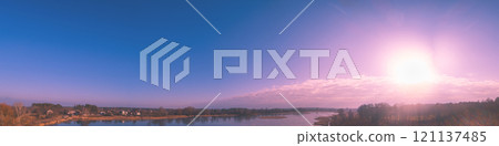 Magical sunset over the lake. Landscape panorama. View from above. Serene lake in the evening. Nature landscape 121137485