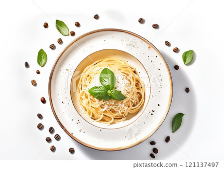 The image presents a beautifully arranged dish of spaghetti on a ceramic plate with grated cheese and fresh basil leaves 121137497