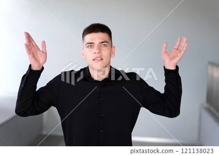 Confused man with hands out 121138023