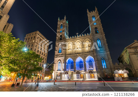 Montreal, Quebec, Canada - August 18 2021 : Night view of Place d'Armes in Old Montreal. Notre-Dame Basilica. Montreal, Quebec, Canada - August 18 2021 : Night view of Place d'Armes in Old Montreal. Notre-Dame Basilica. 121138266