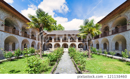 The serene courtyard of the Upper Caravanserai in Shaki, Azerbaijan, with its lush greenery and history The serene courtyard of the Upper Caravanserai in Shaki, Azerbaijan, with its lush greenery and history 121138460
