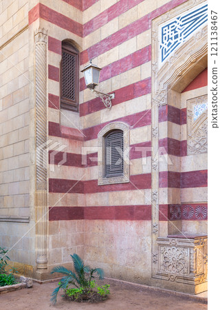 Mamuk style architectural details of a historic building with red and beige stripes in Cairo's cityscape Mamuk style architectural details of a historic building with red and beige stripes in Cairo's cityscape 121138467