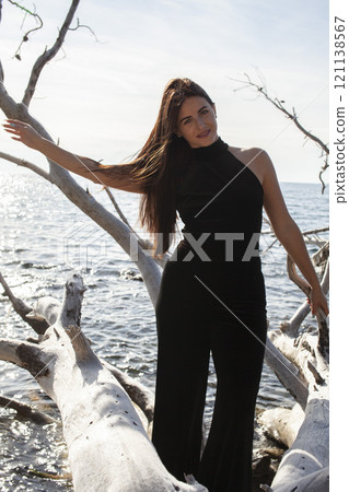 young pretty brunette woman on sea coast, lifestyle people concept close up 121138567