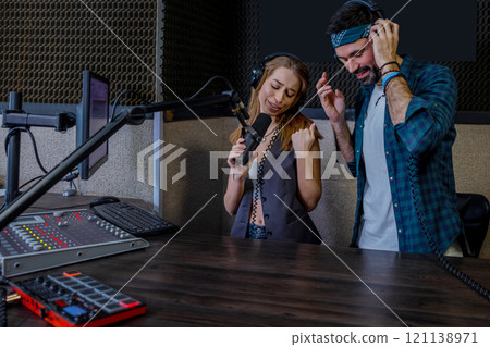 Hipster man and woman playback singers recording track Hipster man and woman playback singers recording track 121138971
