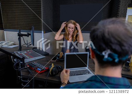Man and woman working in studio Man and woman working in studio 121138972