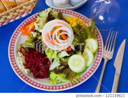 Salad with corn, tomatoes, cucumbers and onions Salad with corn, tomatoes, cucumbers and onions 121139621