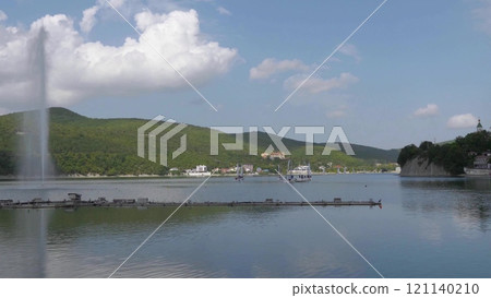 Abrau Durso, Russia 28 August 2024: Panoramic view of the lake Abrau-Durso with sailboats on a sunny day Abrau Durso, Russia 28 August 2024: Panoramic view of the lake Abrau-Durso with sailboats on a sunny day 121140210