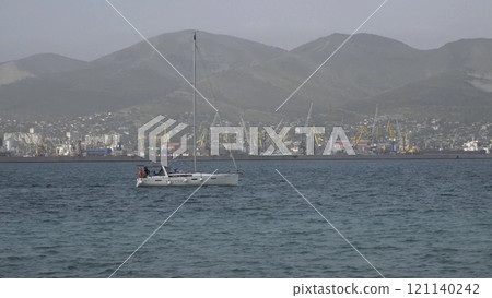 Novorossiysk, Russia - 18 August 2023. red port ship name Maverick in the port of Novorossiysk Black Sea Novorossiysk, Russia - 18 August 2023. red port ship name Maverick in the port of Novorossiysk Black Sea 121140242