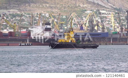 Novorossiysk, Russia - 18 August 2023. red port ship name Stormy in the port of Novorossiysk Black Sea 121140461