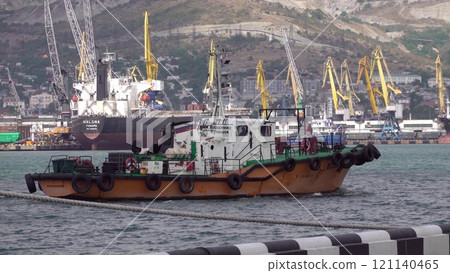 Novorossiysk, Russia - 18 August 2023. red port ship name Vladimir Kulishov in the port of Novorossiysk Black Sea 121140465