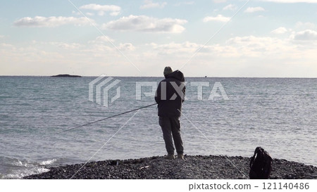 Many fishermen catch mullet fish on a spinning rod on the sea coast Many fishermen catch mullet fish on a spinning rod on the sea coast 121140486