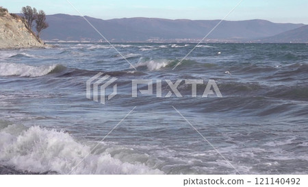 Novorossiysk, Russia - 18 August 2023. red port ship name Maverick in the port of Novorossiysk Black Sea 121140492