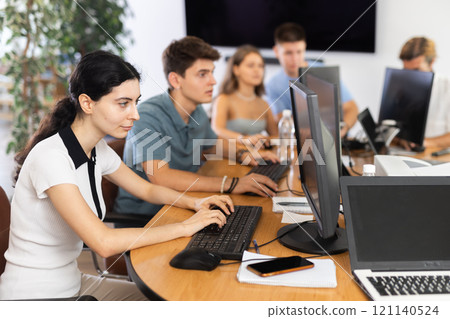 Female student is engrossed Female student is engrossed 121140524