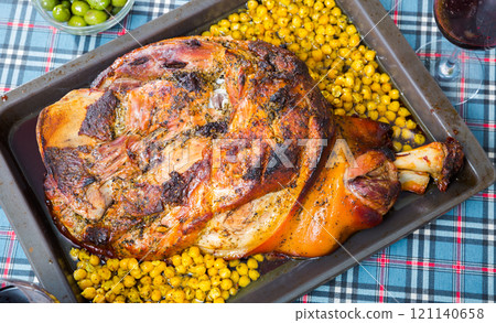 Oven baked pork knuckle 121140658