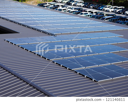 A view of many solar panels installed on the roof of a Japanese factory A view of many solar panels installed on the roof of a Japanese factory 121140811