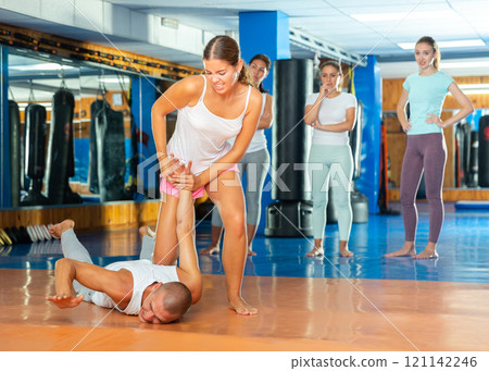 Young lady doing wristlock 121142246