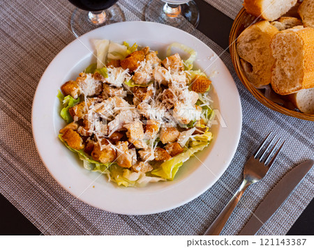 Fresh Caesar salad with chicken on plate Fresh Caesar salad with chicken on plate 121143387
