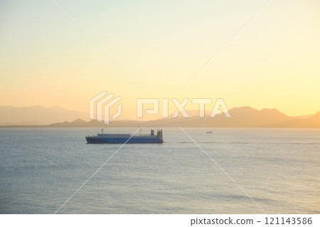 Hakata Bay at dusk with boats floating Hakata Bay at dusk with boats floating 121143586