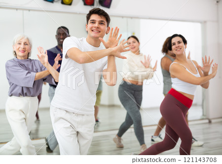 Group of people practicing energetic lindy hop movements 121143708