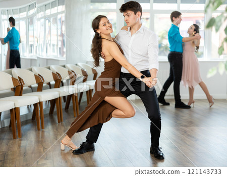 Couple young woman and man dancing tango Couple young woman and man dancing tango 121143733
