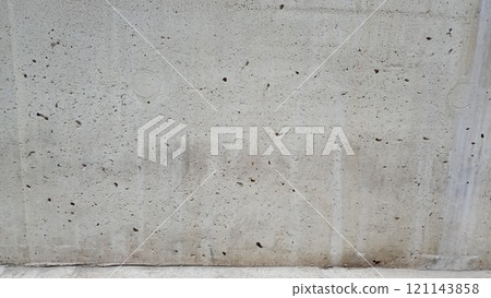 Close up of a weathered concrete surface with visible pores and grains. Ideal for industrial or rustic designs 121143858