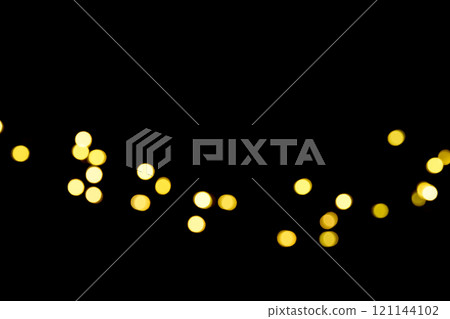 Beautiful Golden Bokeh Lights Shimmering on a Black Background overlay 121144102