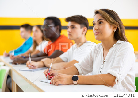 Woman studying in school for taxi drivers Woman studying in school for taxi drivers 121144311