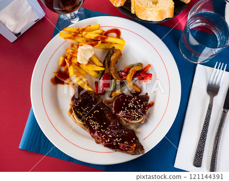 Grill dish Churasco of beef with barbecue sauce with vegetables 121144391