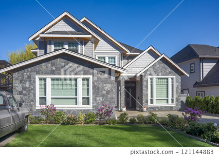 A perfect neighbourhood. Brand new luxury family house on bright spring day A perfect neighbourhood. Brand new luxury family house on bright spring day 121144883