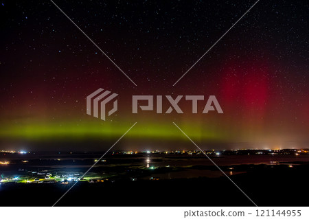 The Aurora Borealis, the northern lights, showing up above Maghery, Burtonport, Arranmore and Dungloe in County Donegal, Ireland. 121144955