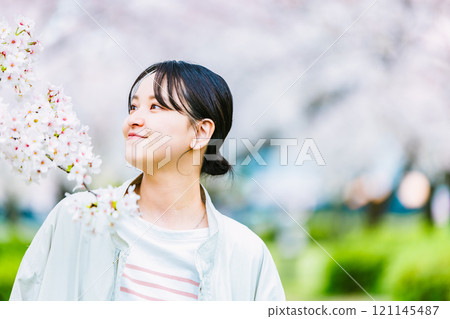 Cherry blossom and young woman 121145487