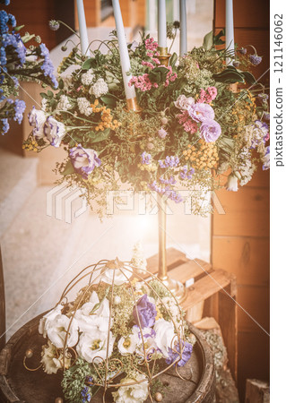 Beautiful romantic elegant wedding decor for a luxury dinner in restaurant. Modern floral design for outdoor wedding in rustic style Beautiful romantic elegant wedding decor for a luxury dinner in restaurant. Modern floral design for outdoor wedding in rustic style 121146062