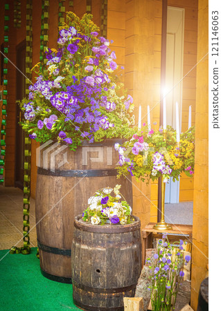 Beautiful romantic elegant wedding decor for a luxury dinner in restaurant. Modern floral design for outdoor wedding in rustic style Beautiful romantic elegant wedding decor for a luxury dinner in restaurant. Modern floral design for outdoor wedding in rustic style 121146063