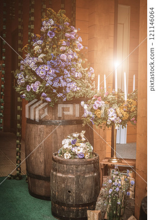 Beautiful romantic elegant wedding decor for a luxury dinner in restaurant. Modern floral design for outdoor wedding in rustic style Beautiful romantic elegant wedding decor for a luxury dinner in restaurant. Modern floral design for outdoor wedding in rustic style 121146064
