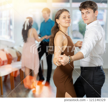 Incendiary swing dance performed by young people in dance studio 121146329