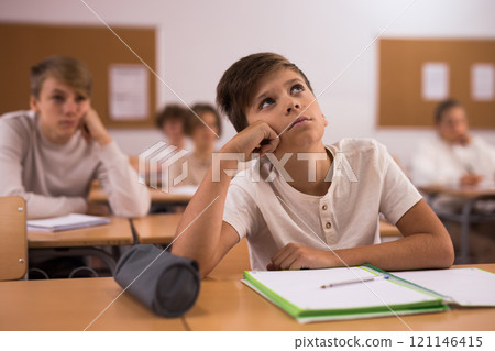 Boy feeling upset after getting bad mark at school Boy feeling upset after getting bad mark at school 121146415