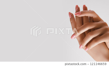 Beautiful Woman Hands. Soft skin, spa skincare concept. Female Hands Applying Cream or Lotion. Hands with pink manicure Beautiful Woman Hands. Soft skin, spa skincare concept. Female Hands Applying Cream or Lotion. Hands with pink manicure 121146659